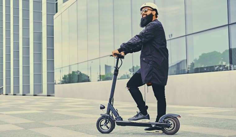 Man riding an electic scooter